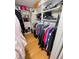 Walk-in closet with built-in shelving and ample space for clothing at 8911 Blind Pass Rd # 220, St Pete Beach, FL 33706