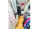 Walk-in closet with built-in shelving, offering ample storage space for an organized wardrobe at 8911 Blind Pass Rd # 220, St Pete Beach, FL 33706