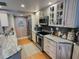 Bright kitchen featuring stainless steel appliances and stone countertops at 8911 Blind Pass Rd # 220, St Pete Beach, FL 33706