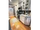 Bright kitchen with stainless steel appliances, custom cabinets, and granite countertops at 8911 Blind Pass Rd # 220, St Pete Beach, FL 33706