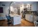 Bright kitchen features stainless steel appliances and an island with seating at 8911 Blind Pass Rd # 220, St Pete Beach, FL 33706