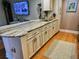 Kitchen featuring sink, storage, light countertops, and stainless steel hardware at 8911 Blind Pass Rd # 220, St Pete Beach, FL 33706