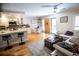 Open floorplan with living room and kitchen featuring bamboo flooring at Boca Shores Condominiums at 8911 Blind Pass Rd # 220, St Pete Beach, FL 33706