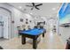 Spacious game room featuring a blue pool table and an open floor plan at 10839 Wild Cotton Ct, Land O Lakes, FL 34638