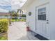 Home patio offering an outdoor living space with seating, potted plants, and serene views at 14336 93Rd Ave, Seminole, FL 33776