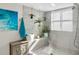 Modern shower with decorative tile, rain shower head, and a built-in shelf at 1520 Gulf Blvd # 1407, Clearwater Beach, FL 33767