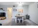 View of dining table and chairs within the living space, neutral decor at 2042 Australia W Way # 66, Clearwater, FL 33763