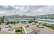 Exterior shot of the building featuring multi-story balconies and parking at 2042 Australia W Way # 66, Clearwater, FL 33763