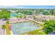 Aerial view of the community lawn bowling area with landscaping and parking at 2042 Australia W Way # 66, Clearwater, FL 33763