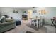 Open living and dining area featuring comfortable seating and carpeted floors at 2042 Australia W Way # 66, Clearwater, FL 33763