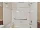 Bathroom featuring white tiled shower and marble-topped tub at 2220 Spanish Dr # 4, Clearwater, FL 33763