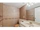Bathroom with floral wallpaper, updated vanity, and tile flooring at 2220 Spanish Dr # 4, Clearwater, FL 33763