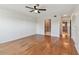 Large bedroom with hardwood flooring includes an ensuite bathroom and closet access at 2220 Spanish Dr # 4, Clearwater, FL 33763