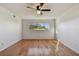 Bright bedroom featuring hardwood floors and a large window for natural light at 2220 Spanish Dr # 4, Clearwater, FL 33763