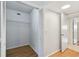 Walk-in closet featuring hardwood floors and shelving at 2220 Spanish Dr # 4, Clearwater, FL 33763