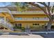 Multi-story building with balconies and manicured landscaping at 2220 Spanish Dr # 4, Clearwater, FL 33763