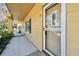 Inviting condo exterior featuring a covered porch and updated windows for a blend of comfort and charm at 2220 Spanish Dr # 4, Clearwater, FL 33763