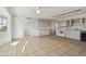 Open kitchen area with tile flooring and ample space for dining and entertaining at 2220 Spanish Dr # 4, Clearwater, FL 33763