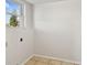 Functional laundry room space with a window for natural light at 2220 Spanish Dr # 4, Clearwater, FL 33763