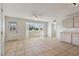 Bright living space featuring tile flooring, a bay window, and built-in cabinets at 2220 Spanish Dr # 4, Clearwater, FL 33763