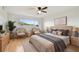 Serene main bedroom featuring a king-sized bed, natural light, and stylish decor at 2220 Spanish Dr # 4, Clearwater, FL 33763