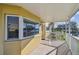 View of an outdoor porch with a beautiful water view and white railings at 2220 Spanish Dr # 4, Clearwater, FL 33763