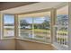 Inviting window nook with serene views of the lake and surrounding nature trails at 2220 Spanish Dr # 4, Clearwater, FL 33763