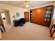 Versatile bedroom setup with neutral carpet, desk, and built-in storage, perfect for a home office or guest room at 2351 Irish Ln # 43, Clearwater, FL 33763