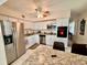 Bright kitchen with white cabinets, stainless appliances, and a breakfast bar for casual dining at 2351 Irish Ln # 43, Clearwater, FL 33763
