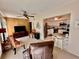 Comfortable living room with wood paneled accent wall, leading into the adjacent kitchen at 2351 Irish Ln # 43, Clearwater, FL 33763