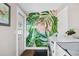 Laundry room featuring a whimsical tropical mural, hexagon tile floors, and new washer and dryer at 3002 N 16Th St, Tampa, FL 33605