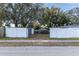 View of fenced backyard showing a shed and a metal carport at 3017 E Jean St, Tampa, FL 33610