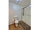 The bathroom features a toilet, rug, and a shower with glass door at 34344 Timberland Blvd, Wesley Chapel, FL 33543