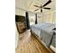 This bedroom has modern furnishings, wood laminate floors, and natural light at 34344 Timberland Blvd, Wesley Chapel, FL 33543