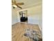 A living room view of a blue sofa visible through an open doorway at 34344 Timberland Blvd, Wesley Chapel, FL 33543