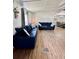 Spacious living area featuring comfortable couches and hardwood floors at 34344 Timberland Blvd, Wesley Chapel, FL 33543