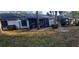View of the backyard showcasing the patio and landscaping at 3859 Pheasant Ct, Palm Harbor, FL 34685