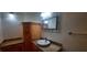 Bathroom with custom wood cabinets, granite countertop, and vessel sink at 3859 Pheasant Ct, Palm Harbor, FL 34685