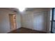 Bedroom with ample closet space and neutral decor at 3859 Pheasant Ct, Palm Harbor, FL 34685