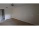 Bedroom with neutral carpet featuring a ceiling fan and a bright window at 3859 Pheasant Ct, Palm Harbor, FL 34685