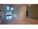 Spacious living room featuring a ceiling fan, and plenty of natural light at 3859 Pheasant Ct, Palm Harbor, FL 34685
