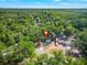 Beautiful aerial shot showcasing the home nestled among mature trees and expansive greenery at 3908 Alafia Blvd, Brandon, FL 33511