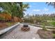 Backyard featuring a fire pit and dock with seating on the river, perfect for relaxing and entertaining at 3908 Alafia Blvd, Brandon, FL 33511