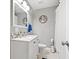 Bathroom featuring shower/tub combo, white cabinets, marble countertop and an anchor wall decoration at 3908 Alafia Blvd, Brandon, FL 33511