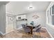 Stylish dining area with a glass table and seating for four at 3908 Alafia Blvd, Brandon, FL 33511