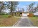 Front exterior of a beautiful house featuring a well-maintained lawn and inviting curb appeal at 3908 Alafia Blvd, Brandon, FL 33511