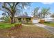 Front exterior of a one-story residence, showcasing the well-kept lawn and charming curb appeal at 3908 Alafia Blvd, Brandon, FL 33511