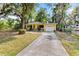 Front exterior of a beautiful house featuring a well-maintained lawn and inviting curb appeal at 3908 Alafia Blvd, Brandon, FL 33511