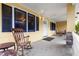 Cozy covered front porch with rocking chair and sitting area at 3908 Alafia Blvd, Brandon, FL 33511