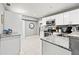 Bright kitchen with granite countertops, stainless steel appliances and white cabinets at 3908 Alafia Blvd, Brandon, FL 33511